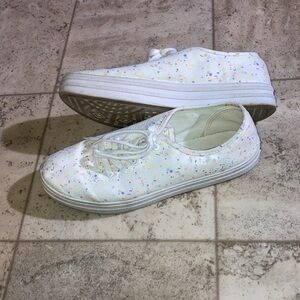 White paint splatter Keds. In good shape. Tread is a bit stained.